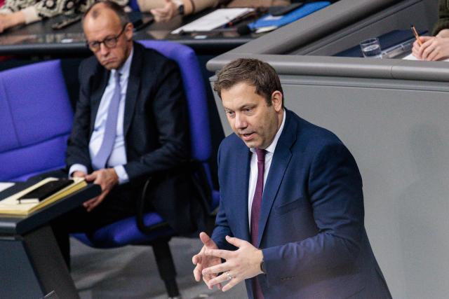 14 November 2025, Berlin: Lars Klingbeil (R), German Minister of Finance, speaks alongside German Chancellor Friedrich Merz in the German Bundestag on the Active Pensions Act. Photo: Carsten Koall/dpa