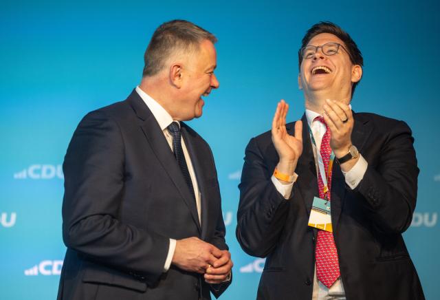 15 November 2025, Rhineland-Palatinate, Morbach: Gordon Schnieder (L), party chairman of the CDU Rhineland-Palatinate, laughs on stage next to Johannes Steiniger, Secretary General of the CDU Rhineland-Palatinate, at the Rhineland-Palatinate CDU state party conference. The program of the delegates' meeting includes the list of candidates for the 2026 state elections in Rhineland-Palatinate. Photo: Harald Tittel/dpa