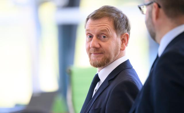 FILED - 29 October 2025, Saxony, Dresden: Minister President of Saxony Michael Kretschmer stands in the plenary chamber before the start of the session of the Saxon State Parliament. Photo: Robert Michael/dpa
