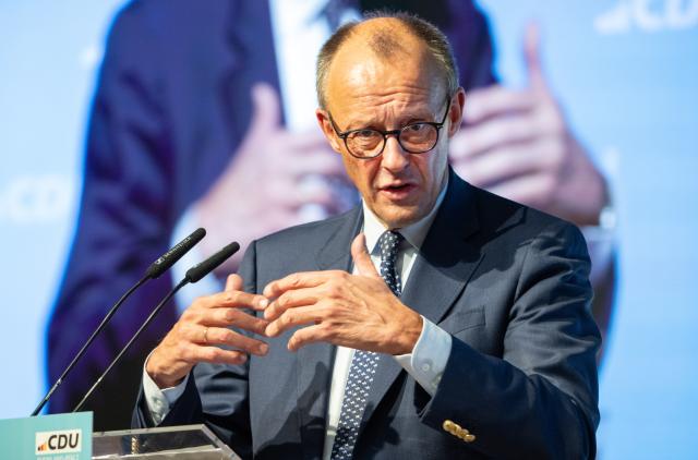15 November 2025, Rhineland-Palatinate, Morbach: German Chancellor Friedrich Merz speaks at the Rhineland-Palatinate Christian Democratic Union of Germany (CDU) state party conference. Among other things, the delegates elected the list of candidates for the 2026 state elections. Photo: Harald Tittel/dpa