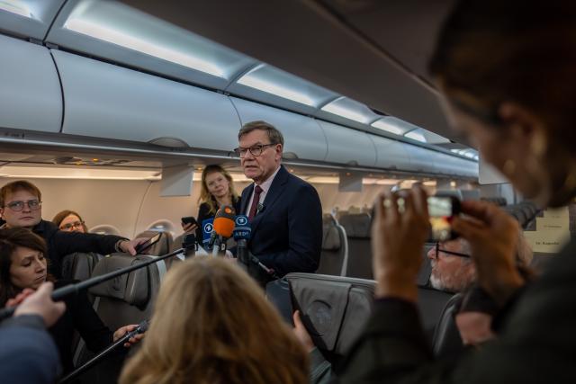 16 November 2025, Brandenburg, Schoenefeld: Johann Wadephul, Germany's Foreign Minister, speaks to reporters on the plane before taking off for the Western Balkans countries. Photo: Michael Kappeler/dpa