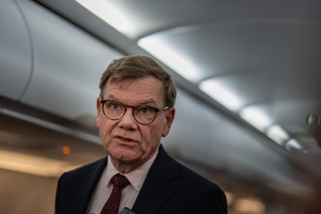 16 November 2025, Brandenburg, Schoenefeld: Johann Wadephul, Germany's Foreign Minister, speaks to reporters on the plane before taking off for the Western Balkans countries. Photo: Michael Kappeler/dpa