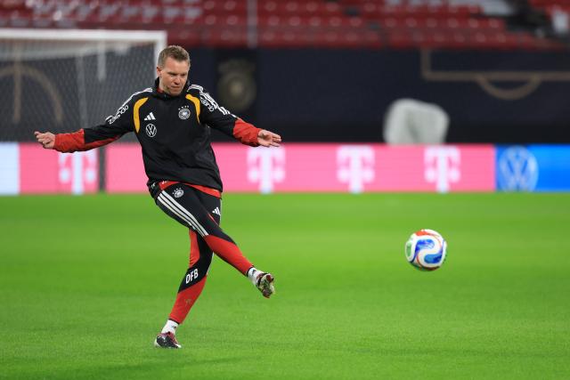 16 November 2025, Saxony, Leipzig: Germany's coach Julian Nagelsmann kicks the ball during a training session ahead of the FIFA World Cup European qualifying soccer match against Slovakia. Photo: Jan Woitas/dpa