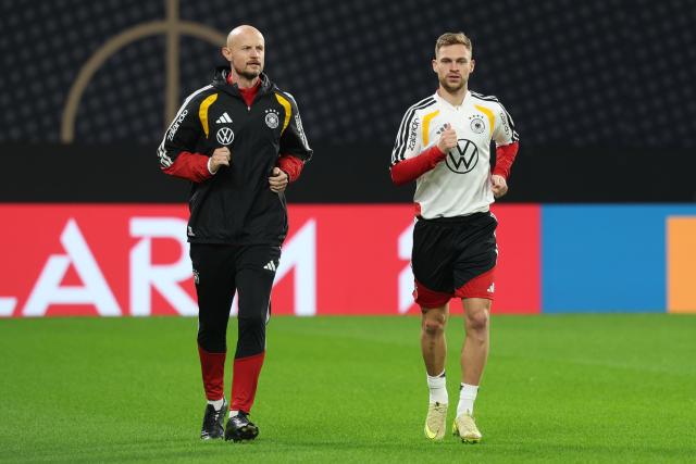 16 November 2025, Saxony, Leipzig: Germany's Joshua Kimmich (R) and Krunoslav Banovcic in action during a training session ahead of the FIFA World Cup European qualifying soccer match against Slovakia. Photo: Jan Woitas/dpa