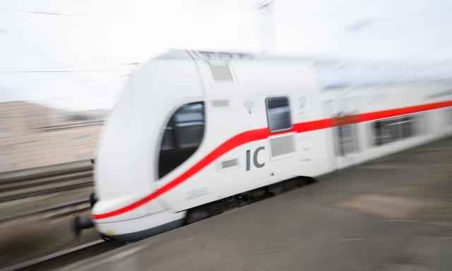 FILED - 18 March 2024, Lower Saxony, Hanover: An Intercity 2 train passes through Hanover Central Station. The European Commission recently announced a comprehensive new transport package, including an action plan to accelerate the development of a high-speed rail network across Europe. Photo: Julian Stratenschulte/dpa