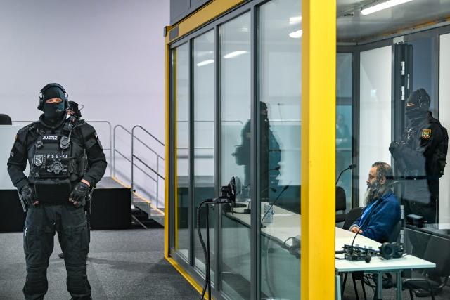 17 November 2025, Saxony-Anhalt, Magdeburg: Defendant Taleb al-Abdulmohsen sits in a bulletproof glass box at Magdeburg District Court during the trial. The public prosecutor's office is accusing the man from Saudi Arabia of 338 counts of attempted murder. On December 20, 2024, Taleb al-Abdulmohsen drove into a crowd of people at Magdeburg's Christmas market, killing 6 and injuring more than 300 people. Photo: Heiko Rebsch/dpa