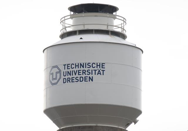 FILED - 20 November 2023, Saxony, Dresden: The words "Technische Universität Dresden" are written on a water tower at the Mollier Building of TU Dresden. A laser ice drill developed in part by Dresden University of Technology (DUT) could help the exploration of of frozen regions in space by drilling through kilometres-thick ice, according to an article in the December edition of the Astra Astronautica journal. Photo: Robert Michael/dpa
