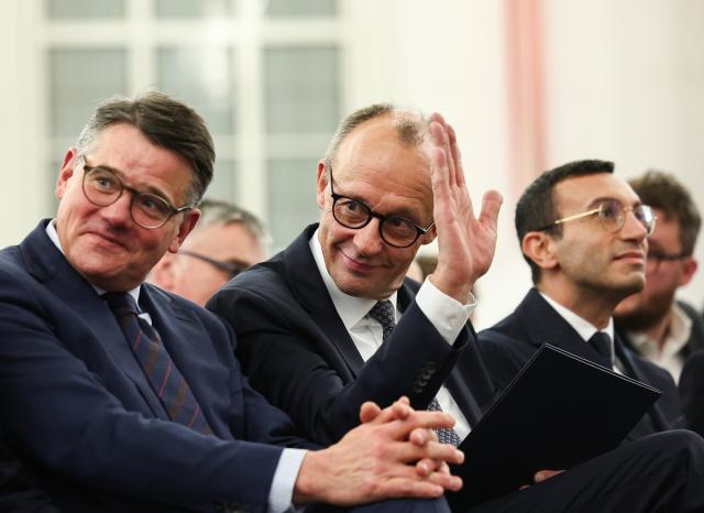 17 November 2025, Hesse, Frankfurt_Main: (L-R) Boris Rhein, Minister President of Hesse, Germany's Chancellor Friedrich Merz, and Mike Josef, Lord Mayor of Frankfurt, sit together as banker Friedrich von Metzler is posthumously awarded the "European Banker" prize. Photo: Hannes P. Albert/dpa