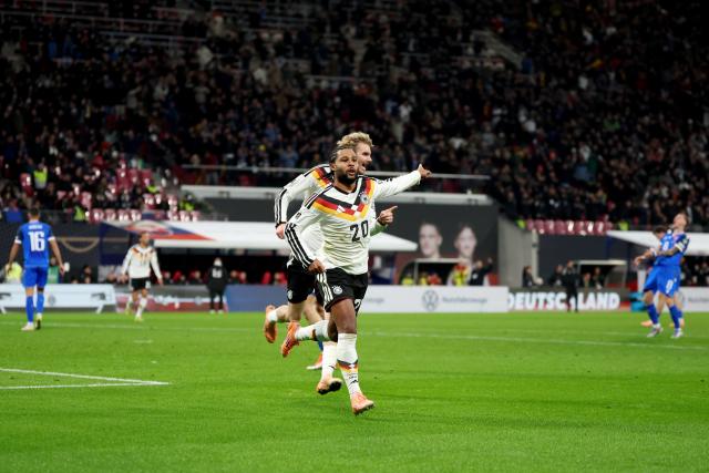 17 November 2025, Saxony, Leipzig: Germany's Serge Gnabry (F) celebrates with Germany's Nick Woltemade after scoring his side's second goal of the game during the FIFA World Cup European qualifying match between Germany and Slovakia at Red Bull Arena. Photo: Christian Charisius/dpa