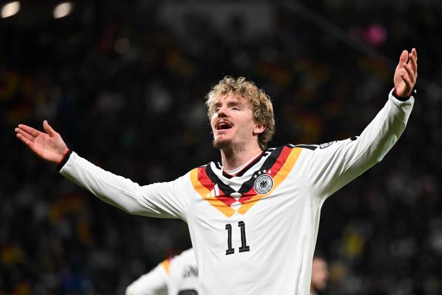 17 November 2025, Saxony, Leipzig: Germany's Nick Woltemade celebrates after scoring his side's first goal of the game during the FIFA World Cup European qualifying match between Germany and Slovakia at Red Bull Arena. Photo: Robert Michael/dpa