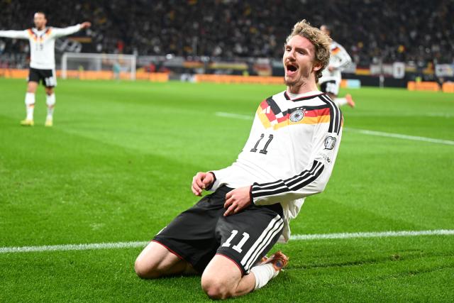 17 November 2025, Saxony, Leipzig: Germany's Nick Woltemade celebrates after scoring his side's first goal of the game during the FIFA World Cup European qualifying match between Germany and Slovakia at Red Bull Arena. Photo: Robert Michael/dpa