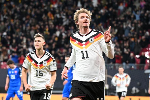 17 November 2025, Saxony, Leipzig: Germany's Nick Woltemade celebrates after scoring his side's first goal of the game during the FIFA World Cup European qualifying match between Germany and Slovakia at Red Bull Arena. Photo: Robert Michael/dpa