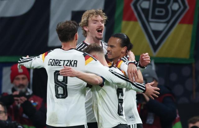 17 November 2025, Saxony, Leipzig: Germany's Leon Goretzka, Nick Woltemade, Joshua Kimmich and Leroy Sane react after scoring his side's third goal of the game during the FIFA World Cup European qualifying match between Germany and Slovakia at Red Bull Arena. Photo: Jan Woitas/dpa