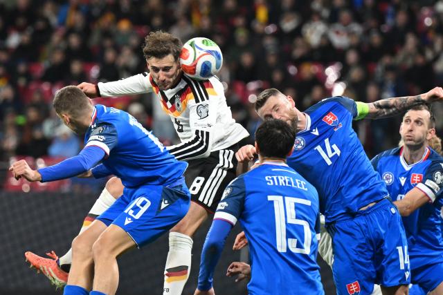 17 November 2025, Saxony, Leipzig: Germany's Leon Goretzka (2nd L) goes up for a header during the FIFA World Cup European qualifying match between Germany and Slovakia at Red Bull Arena. Photo: Robert Michael/dpa