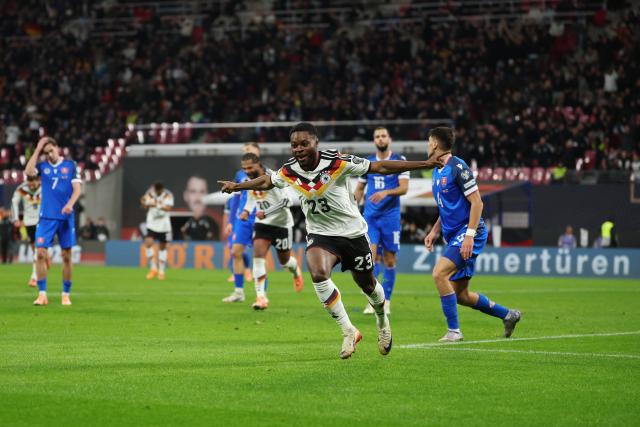 17 November 2025, Saxony, Leipzig: Germany's Ridle Baku celebrates after scoring his side fifth goal of the game during the FIFA World Cup European qualifying match between Germany and Slovakia at Red Bull Arena. Photo: Christian Charisius/dpa