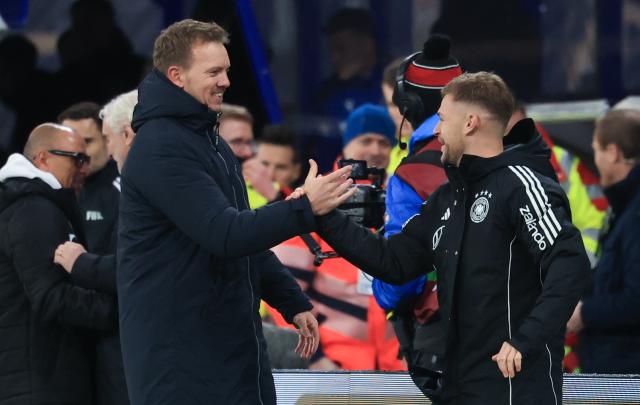 17 November 2025, Saxony, Leipzig: Germany coach Julian Nagelsmann (L), and Germany's Joshua Kimmich react after the final whistle of the FIFA World Cup European qualifying match between Germany and Slovakia at Red Bull Arena. Photo: Jan Woitas/dpa