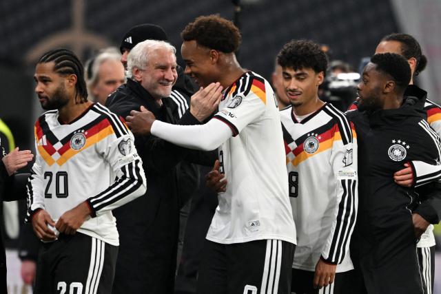 17 November 2025, Saxony, Leipzig: DFB director Rudi Voeller (2nd L) congratulates Germany's Assan Ouedraogo (C) after he scored his side's sixth goal during the FIFA World Cup European qualifying match between Germany and Slovakia at Red Bull Arena. Photo: Robert Michael/dpa