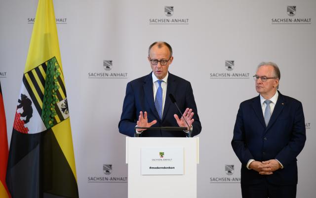 18 November 2025, Saxony-Anhalt, Halle: German Chancellor Friedrich Merz (L) and Minister President of Saxony-Anhalt Reiner Haseloff make a press statement during their visit to the National Academy of Sciences Leopoldina after a cabinet meeting. Photo: Robert Michael/dpa