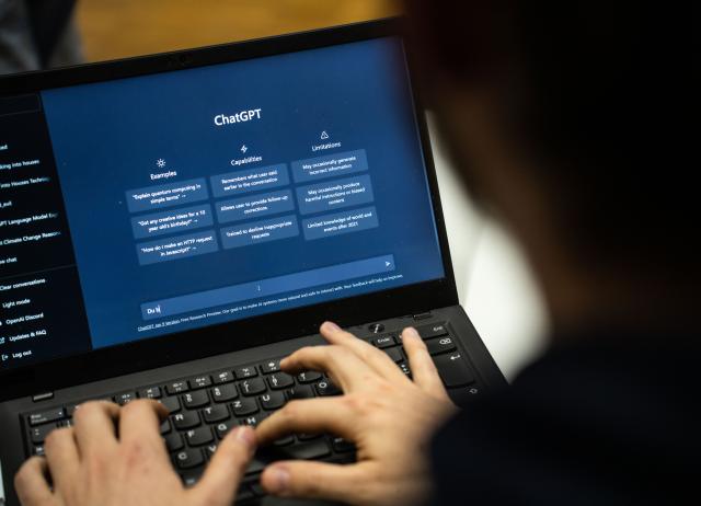 FILED - 25 January 2023, Hesse, Darmstadt: A person enters a text in ChatGPT. A technical fault at internet provider Cloudflare has made a number of websites and online apps inaccessible. Photo: Frank Rumpenhorst/dpa