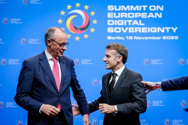 18 November 2025, Berlin: French President Emmanuel Macron (R) and German Chancellor Friedrich Merz take part in the European Digital Sovereignty Summit at the Euref Campus. The summit takes place at the invitation of the German and French digital ministries. Photo: Kay Nietfeld/dpa