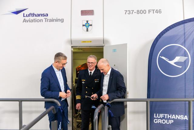 18 November 2025, Berlin: Stefan Evers (L), Berlin Senator for Finance, Broder Nielsen (C), Commander of the Naval Aviation Command, and Matthias Spohr, CEO Lufthansa Aviation Training, sympathetically cut a ribbon at the launch of pilot training for the German Navy's P-8A "Poseidon" by Lufthansa Aviation Training. Photo: Carsten Koall/dpa