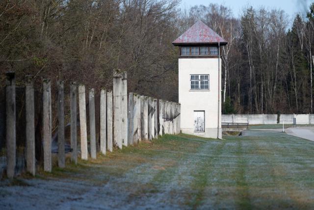 19 November 2025, Bavaria, Dachau: A fence and a watchtower can be seen at the Dachau concentration camp memorial site. Photo: Sven Hoppe/dpa