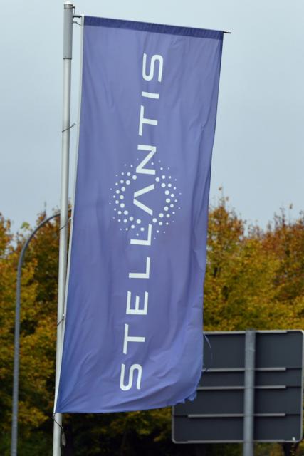FILED - 19 October 2021, Thuringia, Eisenach: The Stellantis logo pictured on a banner outside the Opel plant in Eisenach. Photo: Martin Schutt/ZB/dpa