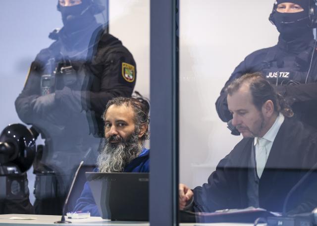 20 November 2025, Saxony-Anhalt, Magdeburg: Defendant Taleb al-Abdulmohsen sits in a bulletproof glass box at Magdeburg District Court during the trial. The public prosecutor's office is accusing the man from Saudi Arabia of 338 counts of attempted murder. On December 20, 2024, Taleb al-Abdulmohsen drove into a crowd of people at Magdeburg's Christmas market, killing 6 and injuring more than 300 people. Photo: Jan Woitas/dpa
