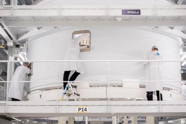 FILED - 18 November 2025, Bremen: Employees work on an intertank structure of the upper stage of an Ariane 6 launcher at the ArianeGroup plant. Photo: Hauke-Christian Dittrich/dpa