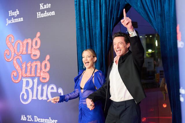 19 November 2025, Berlin: Australian actor Hugh Jackman (R) and US actress Kate Hudson arrive to attend the European premiere of the film "Song Sung Blue" at the Zoo Palast. Photo: Annette Riedl/dpa