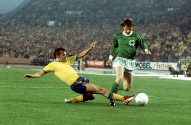 30 June 1974, Duesseldorf: German striker Dieter Herzog (R) in action against Swedish defender Jan Olsson during the 1974 World Cup Group B soccer match between Germany and Sweden at the Rheinstadion. Dieter Herzog, a 1974 World Cup winner with West Germany, passed away this week, a Leverkusen spokesman said, citing Herzog's family. Photo: Karl Schnörrer/dpa