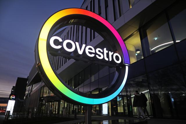 FILED - 11 January 2021, North Rhine-Westphalia, Leverkusen: The logo of the plastics group Covestro shines in front of the new company headquarters at Chempark Leverkusen. Photo: Oliver Berg/dpa