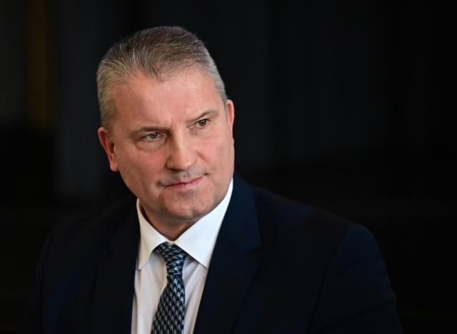23 November 2025, Baden-Wuerttemberg, Hechingen: Martin Hess, deputy state chairman of the AfD Baden-Wuerttemberg, sits on the podium at the state party conference. Photo: Bernd Weißbrod/dpa