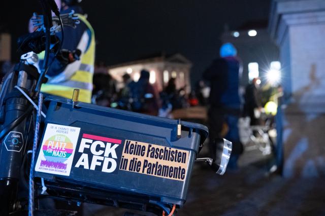 25 November 2025, Brandenburg, Potsdam: Stickers cover a bicycle box as people demonstrate against the right on the second anniversary of the Potsdam meeting of right-wing circles. Photo: Markus Lenhardt/dpa