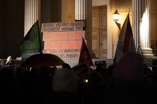 25 November 2025, Brandenburg, Potsdam: Cardboard boxes reading 'WE ARE THE BRANDMAUERS' are displayed during a demonstration in Potsdam. People gather to protest against the right on the second anniversary of the Potsdam meeting of right-wing circles. Photo: Markus Lenhardt/dpa
