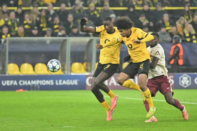 25 November 2025, North Rhine-Westphalia, Dortmund: Borussia Dortmund's Karim Adeyemi scores alongside Serhou Guirassy (L) their side's thrid goal of the game during the UEFA Champions League soccer match between Borussia Dortmund and FC Villarreal at Signal Iduna Park. Photo: Bernd Thissen/dpa