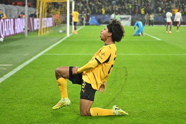 25 November 2025, North Rhine-Westphalia, Dortmund: Borussia Dortmund's Karim Adeyemi celebrates after scoring his side's third goal of the game during the UEFA Champions League soccer match between Borussia Dortmund and FC Villarreal at Signal Iduna Park. Photo: Bernd Thissen/dpa