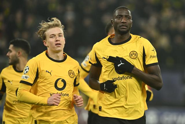 25 November 2025, North Rhine-Westphalia, Dortmund: Borussia Dortmund's Serhou Guirassy and Daniel Svensson (L) celebrate after scoring their side's second goal of the game during the UEFA Champions League soccer match between Borussia Dortmund and FC Villarreal at Signal Iduna Park. Photo: Bernd Thissen/dpa