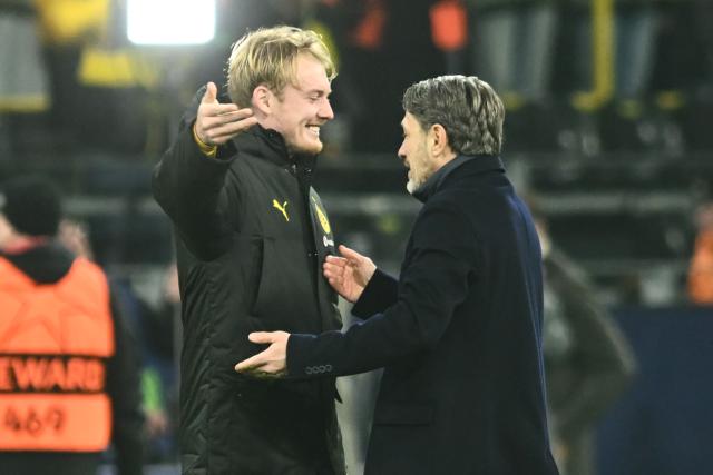 25 November 2025, North Rhine-Westphalia, Dortmund: Borussia Dortmund's Julian Brandt and coach Niko Kovac celebrate after the UEFA Champions League soccer match between Borussia Dortmund and FC Villarreal at Signal Iduna Park. Photo: Bernd Thissen/dpa