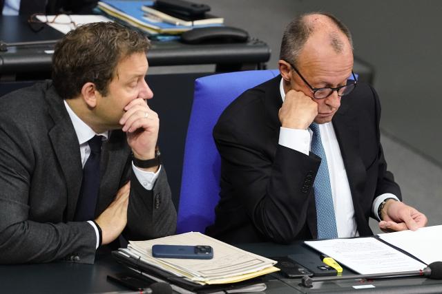 26 November 2025, Berlin: Lars Klingbeil (L), German Minister of Finance, Vice-Chancellor and SPD Federal Chairman, and Friedrich Merz German Chancellor sit before the general debate in the Bundestag. The debates on the budget of the Chancellor's Office are traditionally used as a general debate on the policies of the Federal Government. Photo: Kay Nietfeld/dpa