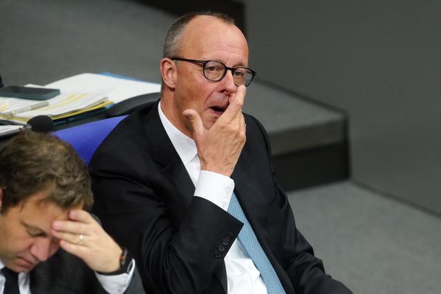 26 November 2025, Berlin: German Chancellor Friedrich Merz reacts during the general debate on the budget in the Bundestag. The debates on the budget of the Chancellery are traditionally used as a general debate on the policies of the Federal Government. Photo: Michael Kappeler/dpa