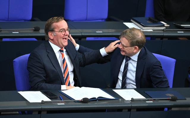 26 November 2025, Berlin: German Foreign Minister Johann Wadephul laughs with German Defence Minister Boris Pistorius during the general debate at the German Bundestag. Photo: Elisa Schu/dpa