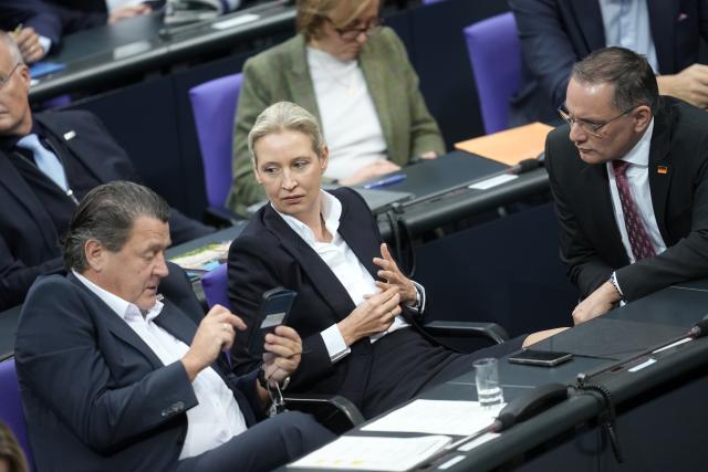 26 November 2025, Berlin: (L-R) Member of the Bundestag Stephan Brandner, parliamentary group and federal chairwmen of the Alternative for Germany (AfD) Alice Weidel and Tino Chrupalla sit in their seats during the general debate in the Bundestag on the budget. Photo: Michael Kappeler/dpa