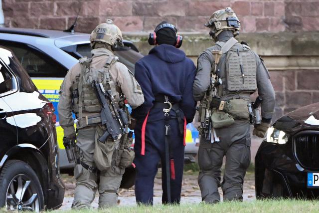 27 November 2025, Baden-Württemberg, Karlsruhe: A suspected mastermind of the attacks on the Nord Stream gas pipelines is led by officers to be transferred from Italy to Germany. He is to be brought before the investigating judge of the German Court of Justice in Karlsruhe for trial. Photo: Uli Deck/dpa