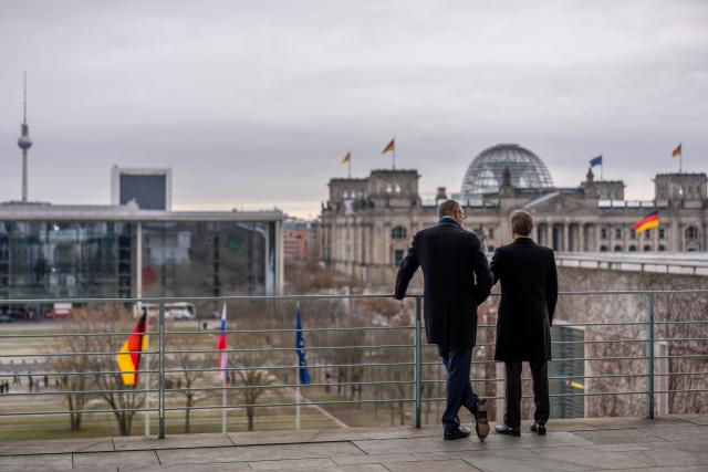 28 November 2025, Berlin: German Chancellor Friedrich Merz (L) stands next to Robert Golob, Prime Minister of Slovenia, on the balcony of the Federal Chancellery. The talks will focus on bilateral relations, joint support for Ukraine, the Western Balkans and European policy issues. Photo: Michael Kappeler/dpa