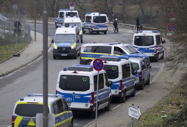 28 November 2025, Hesse, Giessen: Police forces are on standby at the Giessen exhibition center, where thousands of counter-demonstrators are expected to attend the planned re-founding of the Alternative for Germany (AfD) youth organization on Saturday. Photo: Boris Roessler/dpa
