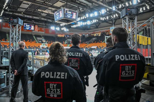 28 November 2025, Bavaria, Neu-Ulm: Police officers stand in the ratiopharm arena ahead of the World Cup European qualifier Basketball match between Germany and Israel. Photo: Harry Langer/dpa