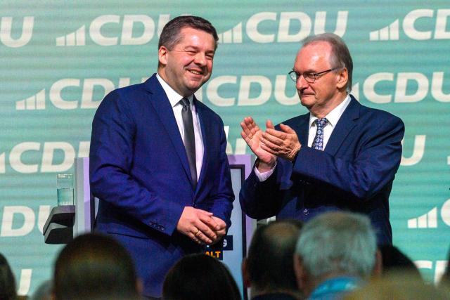 29 November 2025, Saxony-Anhalt, Magdeburg: Reiner Haseloff (r), Minister-President of Saxony-Anhalt, applauds Sven Schulze (l), Chairman of the Saxony-Anhalt CDU and CDU candidate for the 2026 state election, after his speech at the Saxony-Anhalt CDU state party conference. The delegates want to elect a new state executive at the party conference. Photo: Klaus-Dietmar Gabbert/dpa