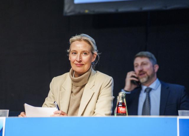 29 November 2025, Hesse, Gießen: Alice Weidel, co-chair of the AfD parliamentary group, sits on the podium at the founding event. Several hundred delegates came together on Saturday for the founding of a new AfD youth organization as the successor to the Junge Alternative, which has been classified as a secure right-wing extremist organization. The Junge Alternative had disbanded by self-imposed resolution. Photo: Andreas Arnold/dpa