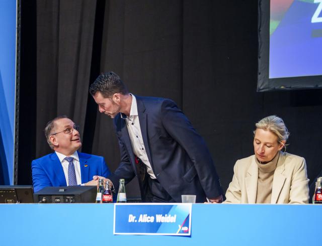 29 November 2025, Hesse, Gießen: Tino Chrupalla (l-r, AfD), co-chair of the AfD parliamentary group in the Bundestag, Andreas Lichert (AfD), spokesman of the AfD Hesse board, and Alice Weidel (AfD), co-chair of the AfD parliamentary group in the Bundestag, are on the podium at the founding event. Several thousand demonstrators protested against the founding of a new AfD youth organization on Saturday. Its predecessor, "Junge Alternative", which was classified as right-wing extremist, had dissolved itself. The two federal co-chairs are also due to speak at the founding event in the Hessenhallen. Photo: Andreas Arnold/dpa